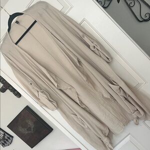 Cream colored boho style jacket.